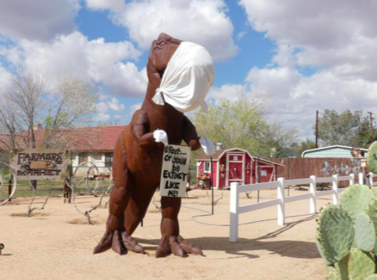 A Tyrannosaurus rex in Apple Valley warns of what could happen if we don't socially distance.