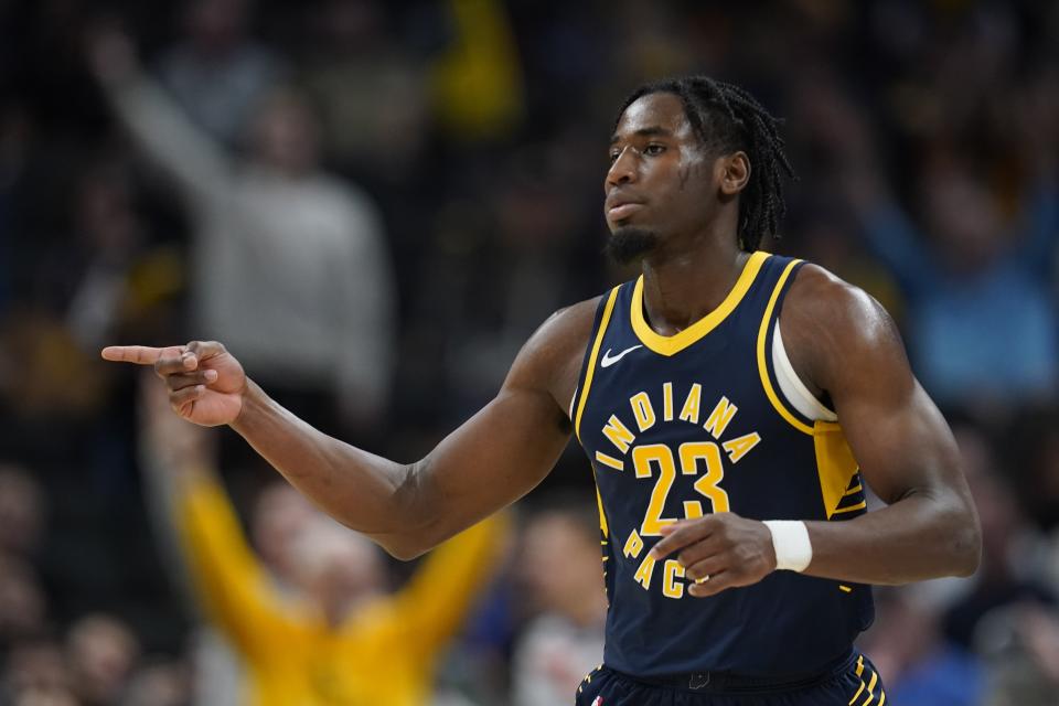 Indiana Pacers' Aaron Nesmith reacts after hitting a shot during the second half of an NBA basketball game against the Utah Jazz, Wednesday, Nov. 8, 2023, in Indianapolis. (AP Photo/Darron Cummings)