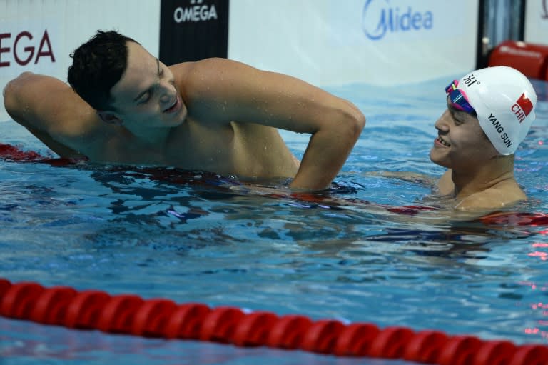 China's Sun Yang (R) and Great Britain's Guy James celebrate after the men's 400m freestyle final swimming event at the 2015 FINA World Championships in Kazan on August 2, 2015