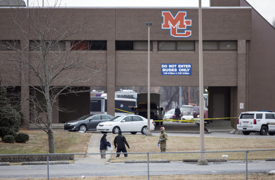 <p>Authorities investigate the scene after a deadly shooting at Marshall County High School in Benton, Ky., Jan. 23, 2018. (Photo: Ryan Hermens/The Paducah Sun via AP) </p>