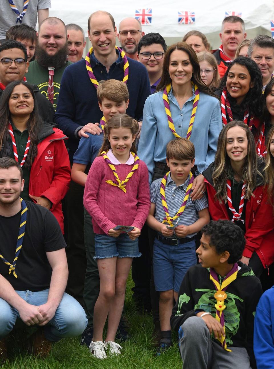 britains catherine, princess of wales, britains prince william, prince of wales, britains prince george of wales, britains prince louis of wales and britains princess charlotte of wales pose for a group pictures with volunteers who are taking part in the big help out, during a visit to the 3rd upton scouts hut in slough, west of london on may 8, 2023, where the family helped to renovate and improve the building people across britain were on monday asked to do their duty as the celebrations for king charles iiis coronation drew to a close with a massive volunteering drive photo by daniel leal pool afp photo by daniel lealpoolafp via getty images