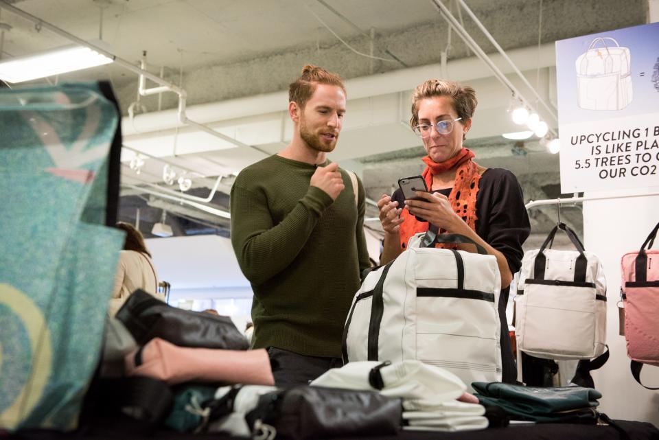 A display of items for sale by eco-friendly maker Rewilder at Unique Markets in Los Angeles, Calif. Rewilder creates backpacks from salvaged airbags and seat belts. 