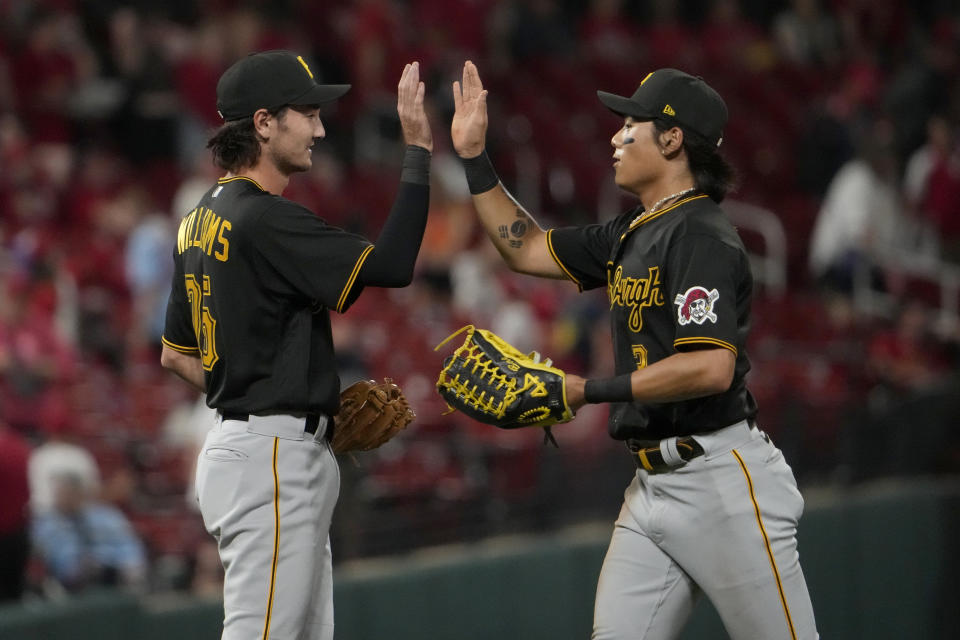 Pittsburgh Pirates' Alika Williams and Ji Hwan Bae, right, celebrate a 4-2 victory over the St. Louis Cardinals in a baseball game Friday, Sept. 1, 2023, in St. Louis. (AP Photo/Jeff Roberson)