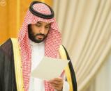 Saudi Arabia's Deputy Crown Prince Mohammed bin Salman looks at a document after Saudi Arabia's cabinet agrees to implement a broad reform plan known as Vision 2030 in Riyadh, April 25, 2016. REUTERS/Saudi Press Agency/Handout via Reuters