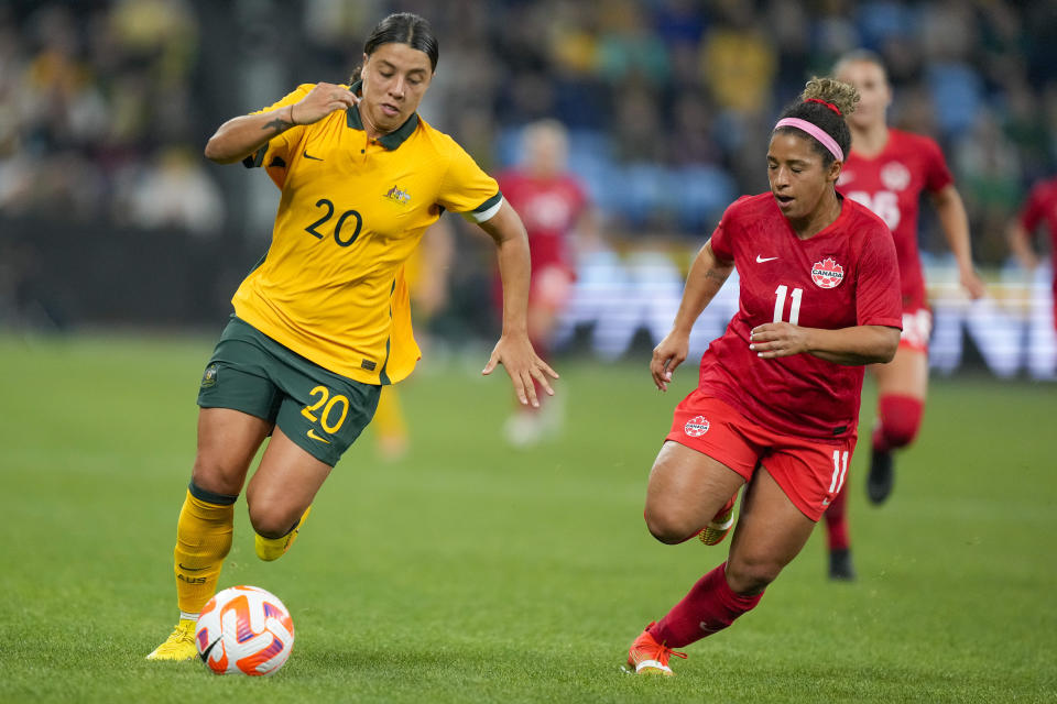 Australia's Sam Kerr, left, and Canada's Desiree Scott compete for the ball during a friendly soccer international between Canada and Australia in Sydney, Australia, Tuesday, Sept. 6, 2022. (AP Photo/Rick Rycroft)