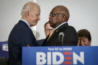 Democratic presidential candidate Joe Biden (L) receiving the endorsement of influential South Carolina congressman James Clyburn (R)