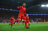 <p>Wales forward Aaron Ramsey sports a fancy tattoo on his right calf with passages of Bible in Welsh and a castle that sits in the town he is from. It took him 20 hours to get the tattoo done, with one sitting extending to over 7 hours. </p>