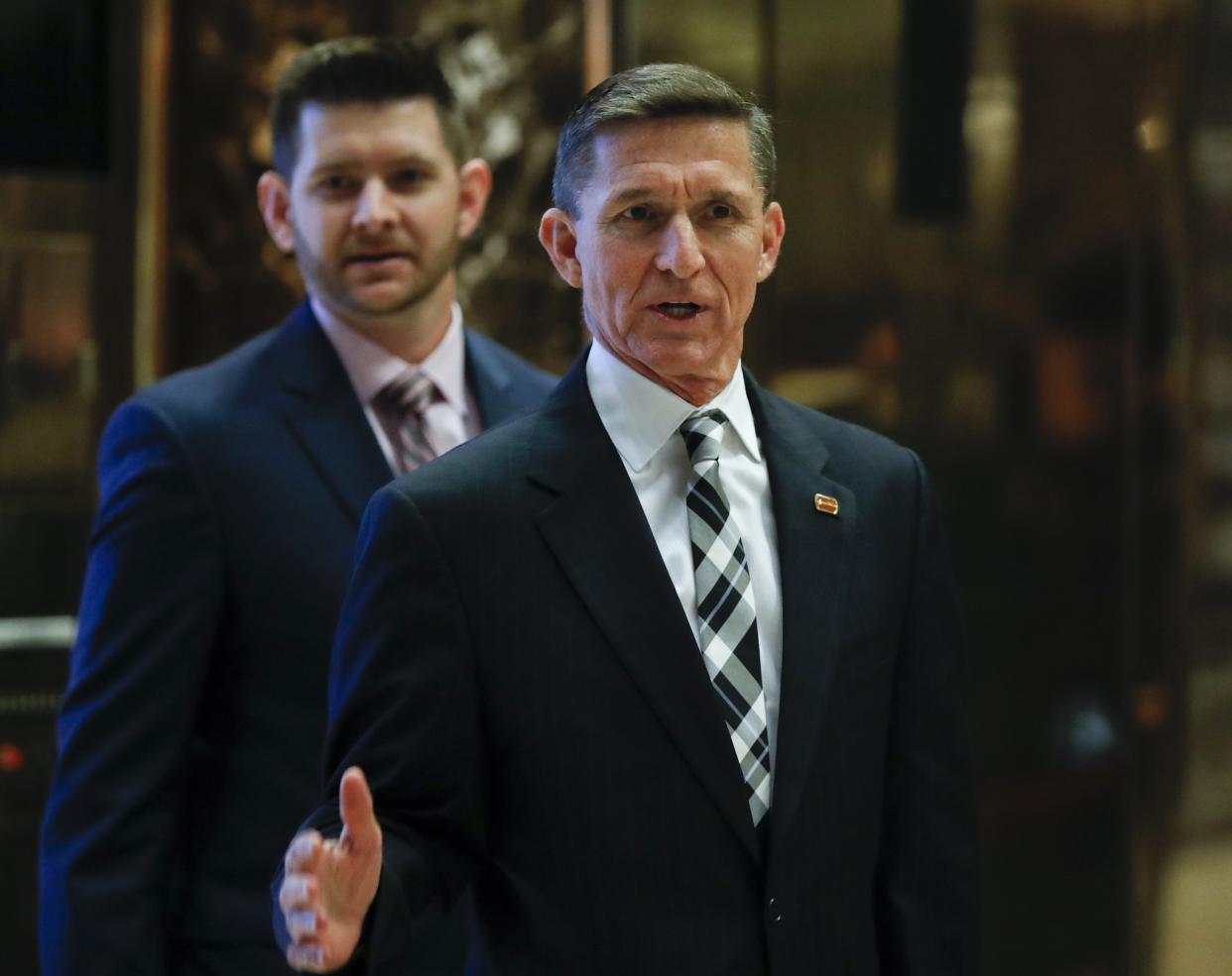 Retired Lt. Gen Michael Flynn talks to media as he arrives at Trump Tower, Thursday, Nov. 17, 2016, in New York. (Photo: Carolyn Kaster/AP)