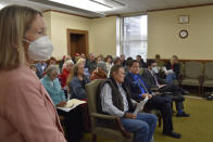 Members of the public gather to provide public testimony to the Montana Redistricting Commission in Helena, Mont., on Tuesday, Oct. 19, 2021. The commission is tasked with determining how to divide the state into two congressional districts for the first time in 30 years. (AP Photo/Iris Samuels)