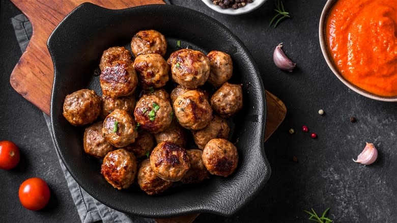 Cooked meatballs in cast iron pan 