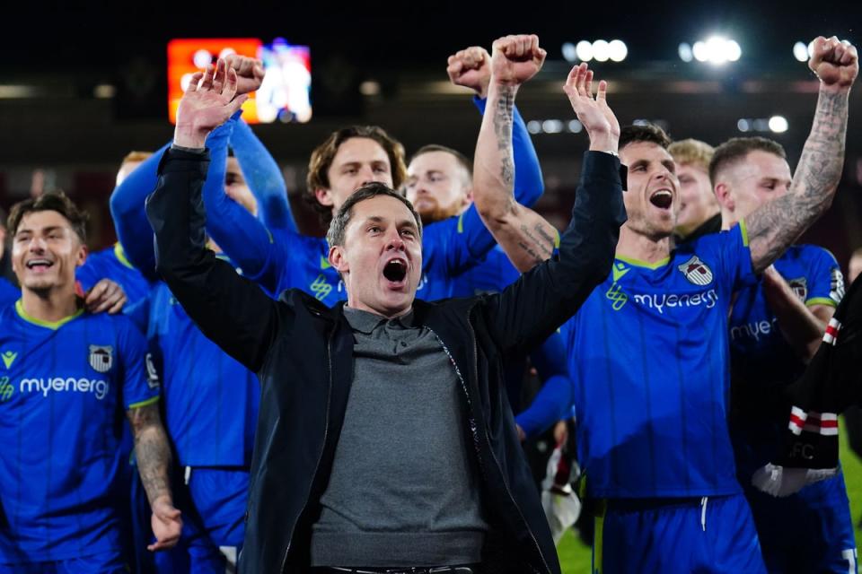 Grimsby players and manager Paul Hurst celebrate a famous win (Zac Goodwin/PA) (PA Wire)