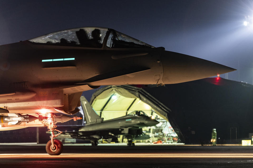 In this photo provided by Britain's Ministry of Defense, a Royal Air Force Typhoon aircraft prepares to take off, along with others, to conduct further strikes against Houthi targets in Yemen, Saturday, Feb. 24, 2024. The strikes answer a recent surge in attacks by the Iran-backed militia group on ships in the Red Sea and Gulf of Aden. (Cpl. Tim Laurence/RAF/UK Ministry of Defense via AP)