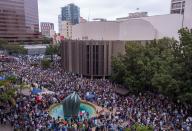 <p>People gather at the San Diego Civic Center to demand that thousands of children taken from their immigrant parents by border officials under recent controversial Trump administration policies be reunited on June 23, 2018 in San Diego, Calif. (Photo: David McNew AFP/Getty Images) </p>