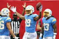 Los Angeles Chargers tight end Donald Parham Jr. (89) celebrates with tight end Hunter Henry (86) and wide receiver Keenan Allen (13) after Parham scored against the Tampa Bay Buccaneers during the first half of an NFL football game Sunday, Oct. 4, 2020, in Tampa, Fla. (AP Photo/Mark LoMoglio)