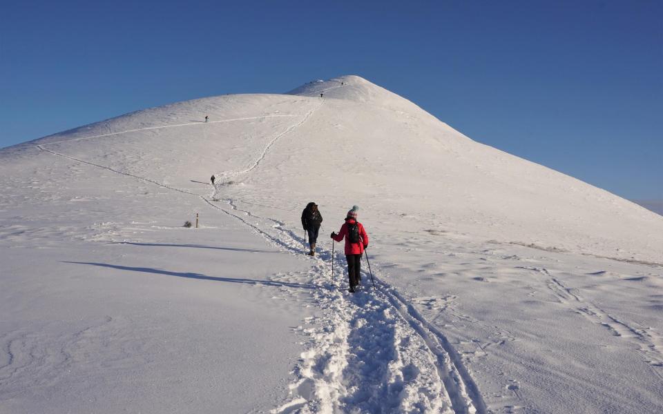 skiers hiking in scotland - Bob Douglas/Getty