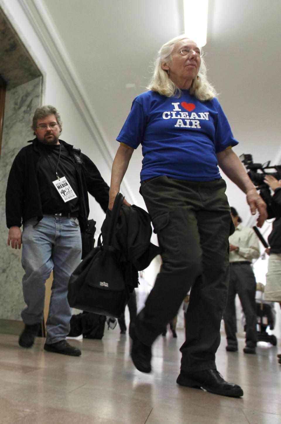 A woman leaves the the Pennsylvania state Supreme Courtroom in Pittsburgh where the court was hearing arguments from seven municipalities challenging portions of a new law that regulates natural gas exploration on Wednesday, Oct. 17, 2012. (AP Photo/Keith Srakocic)