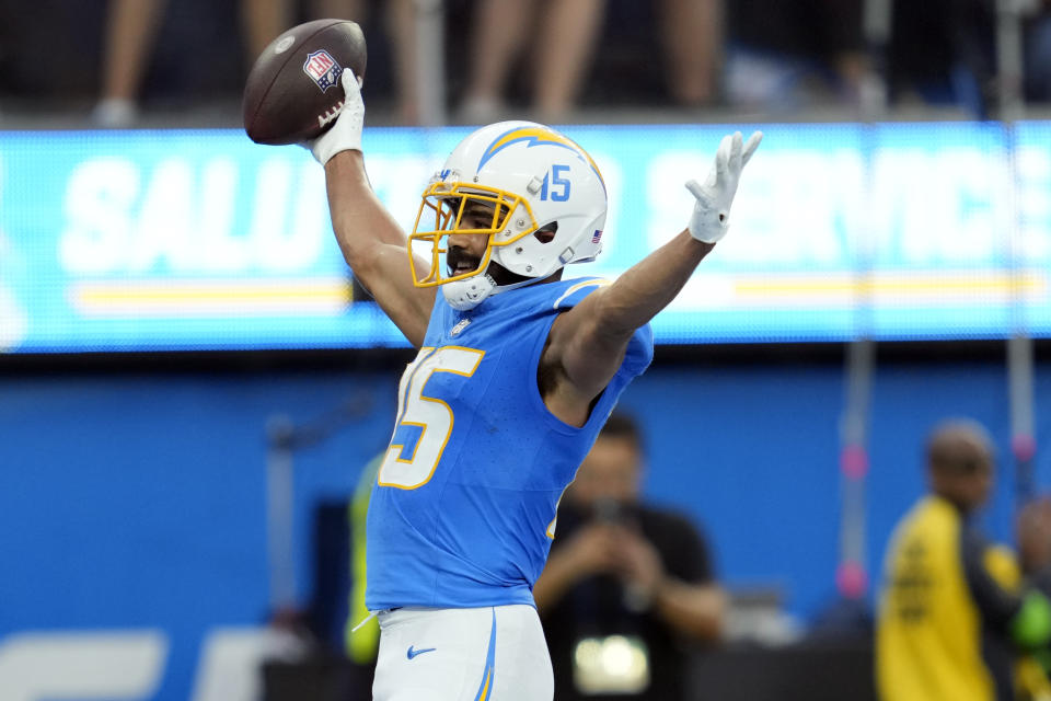 Los Angeles Chargers wide receiver Jalen Guyton (15) celebrates his touchdown catch during the second half an NFL football game against the Detroit Lions Sunday, Nov. 12, 2023, in Inglewood, Calif. (AP Photo/Ashley Landis)