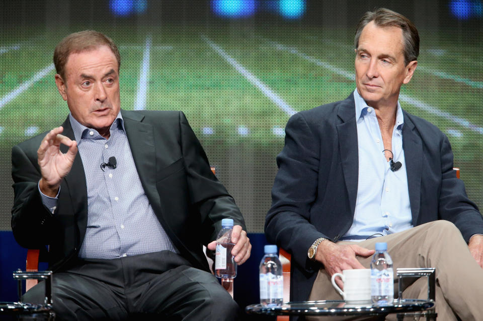 Announcer Al Michaels and analyst Cris Collinsworth didn't seem happy about wearing masks to call the Sunday night game. (Photo by Frederick M. Brown/Getty Images)