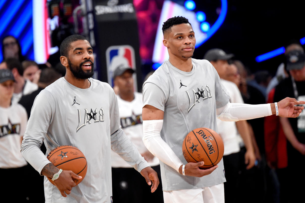 Kyrie Irving and Russell Westbrook, at the 2018 All-Star Game, are the main pieces in a trade package between the Brooklyn Nets and Los Angeles Lakers, league sources told Yahoo Sports. (Kevin Mazur/WireImage)