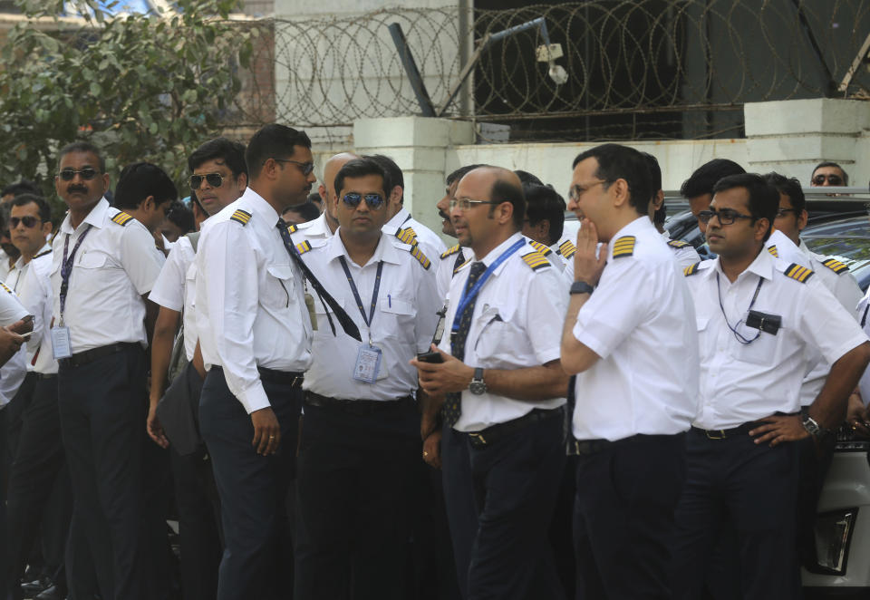 Employees of Jet Airways gather to demand clarification on unpaid salaries at Jet Airways headquarters in Mumbai, India, Monday, April 15, 2019. India's ailing Jet Airways has drastically reduced operations amid talks with investors to purchase a controlling stake in the airline and help it reduce its mounting debt. (AP Photo/Rafiq Maqbool)