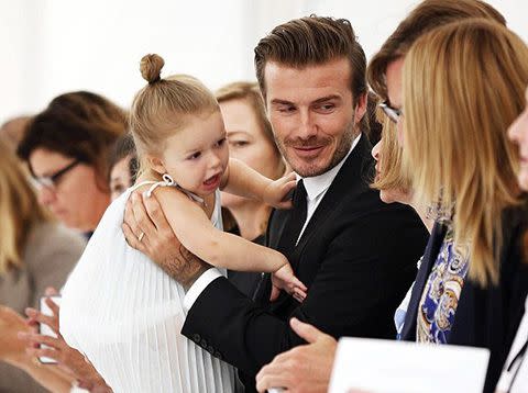 David and Harper Beckham in the front row.