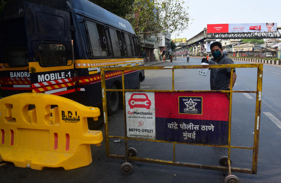 MUMBAI, INDIA - MARCH 26: Mumbai police van sanitisation work done by local corporater from S.V.road bandra during restrictions on citizen's movement on account of section 144 due to COVID 19 pandemic, on March 26, 2020 in Mumbai, India. Prime Minister Narendra Modi on Tuesday announced complete lockdown of the entire country, as part of the governments stringent efforts to tackle coronavirus disease Covid-19. This lockdown will be in place for 21 days and more stringent than Janta Curfew. Although, ration shops, groceries, fruits and vegetable shops, dairy and milk booths, meat and fish shops, animal fodder will remain open during the 21-day lockdown. (Photo by Vijayanand Gupta/Hindustan Times via Getty Images)