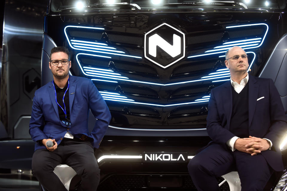 CEO of Italian-American CNH Industrial Hubertus Muhlhauser and CEO and founder of U.S. Nikola Trevor Milton attends a news conference held to presents its new full-electric and hydrogen fuel-cell battery trucks in partnership with U.S. Nikola, at an event in Turin, Italy, December 3, 2019. REUTERS/Massimo Pinca