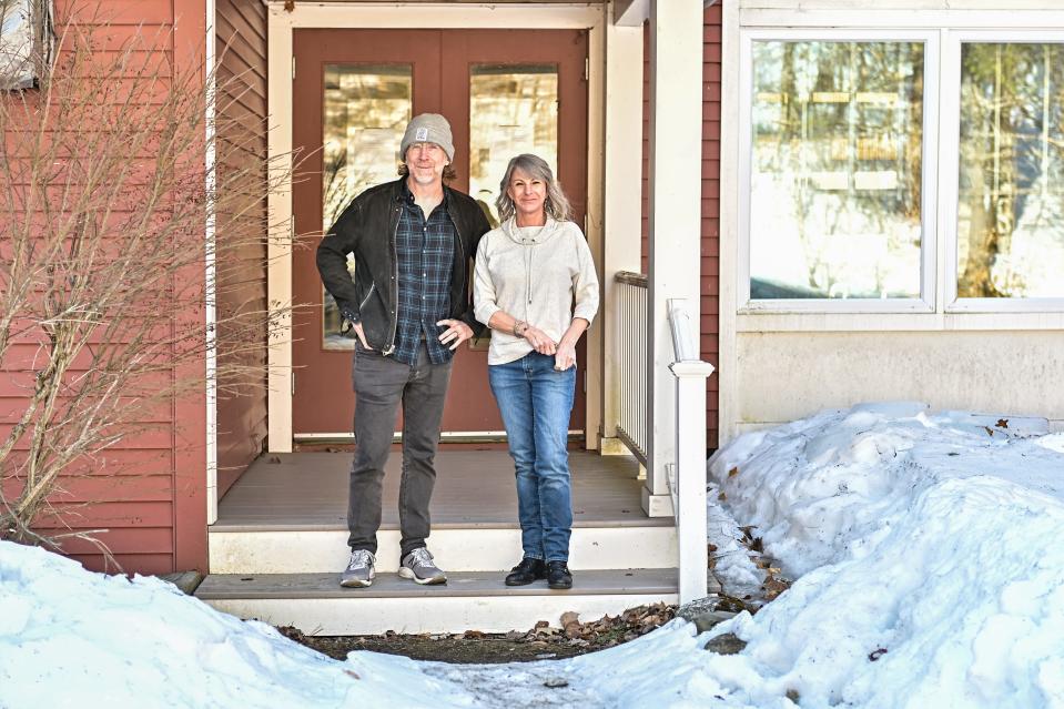 Trey Anastasio of Phish stands with Melanie Gulde, program director of the Divided Sky Residential Recovery Program, outside the facility in Ludlow.