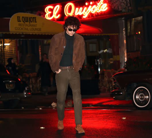 <p>Jose Perez/Bauer-Griffin/GC Images</p> Timothee Chalamet's Bob Dylan leads the El Quijote restaurant in New York City for 'A Complete Unknown'