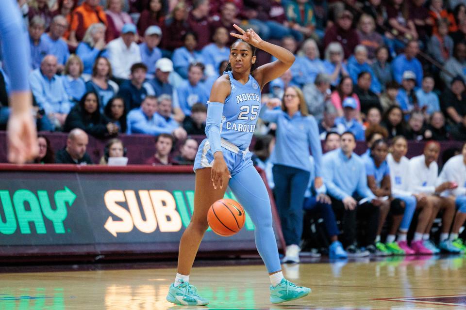 Deja Kelly #25 of the North Carolina Tar Heels calls a play in the first half during a game against the Virginia Tech Hokies at Cassell Coliseum on Feb. 25 in Blacksburg, Virginia.