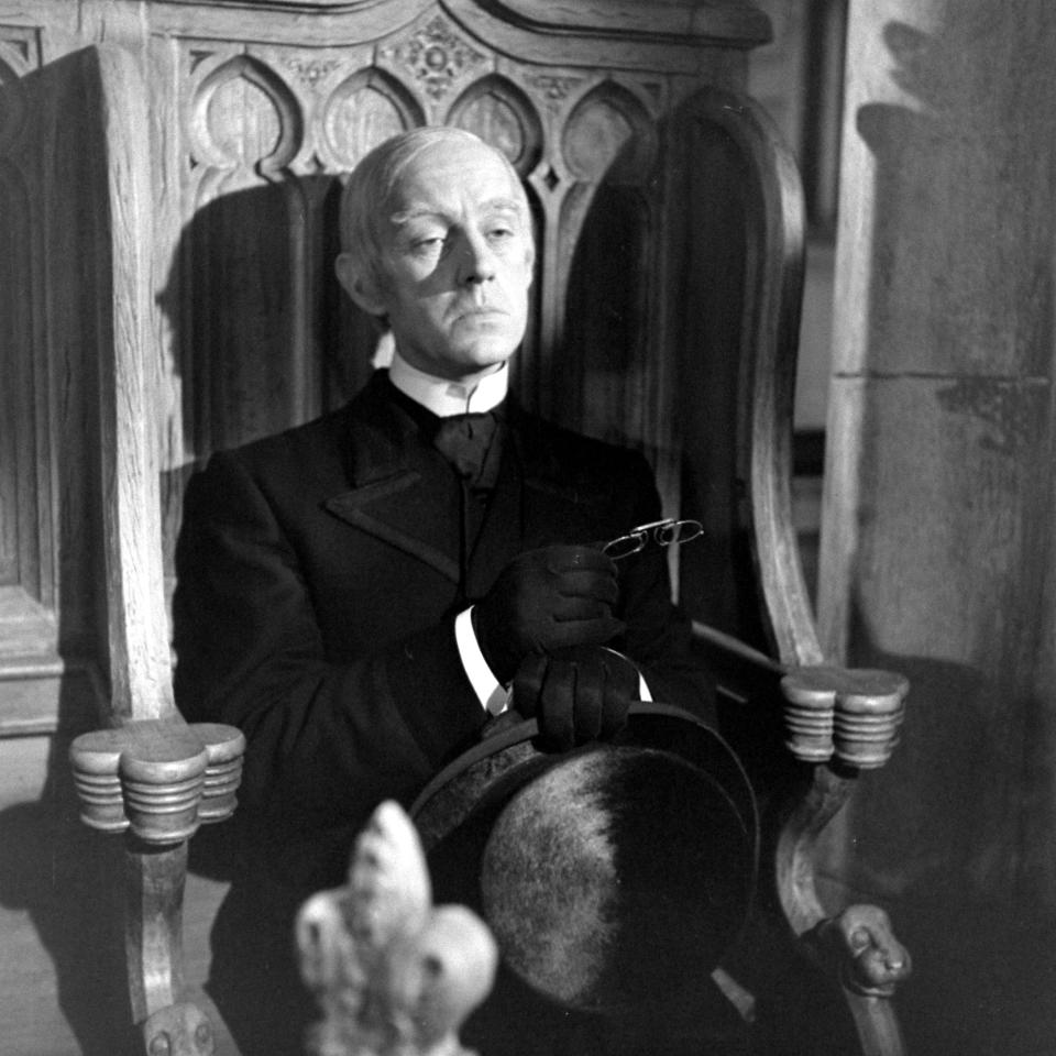 Alec Guinness sitting on the scene from the play 'Kind Hearts and Coronets,' December 1948 (Photo by Mark Kauffman/The LIFE Picture Collection via Getty Images)