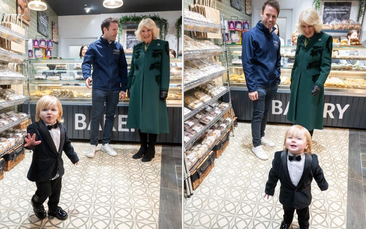 Fitzwilliam Corrie-Salmon photobombs the Queen as she visits  Knotts Bakery in Belfast