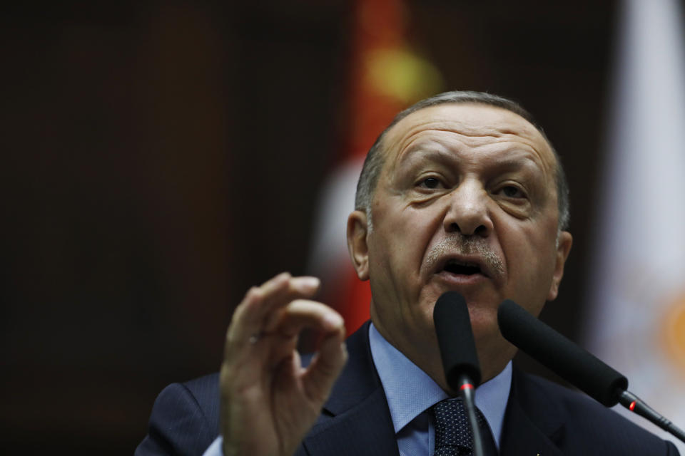 Turkey's President Recep Tayyip Erdogan delivers a speech to MPs of his ruling Justice and Development Party (AKP) at the parliament in Ankara, Turkey, Tuesday, Jan. 8, 2019. Erdogan said Turkey's preparations for a new military offensive against terror groups in Syria are "to a large extent" complete. Erdogan made the comments just hours after U.S. national security adviser John Bolton met with Turkish officials seeking assurances that Turkey won't attack U.S-allied Kurdish militia in Syria. (AP Photo/Burhan Ozbilici)