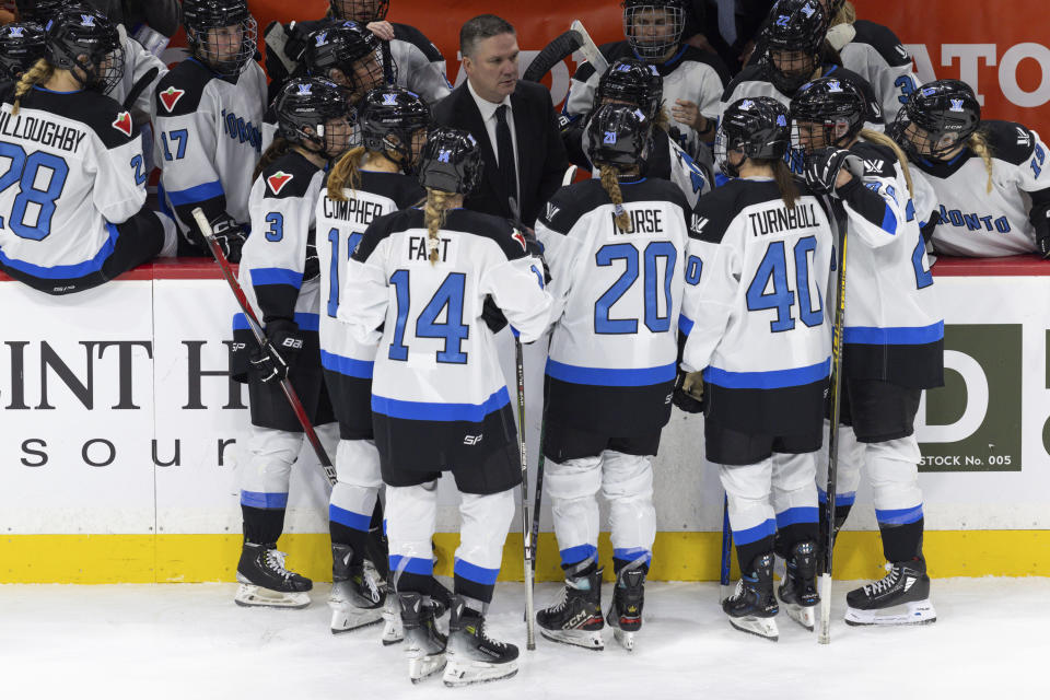 Toronto coach Troy Ryan meets with the team before a faceoff against Minnesota during the third period of a PWHL hockey game Wednesday, Jan. 10, 2024, in St. Paul, Minn. (AP Photo/Bailey Hillesheim)