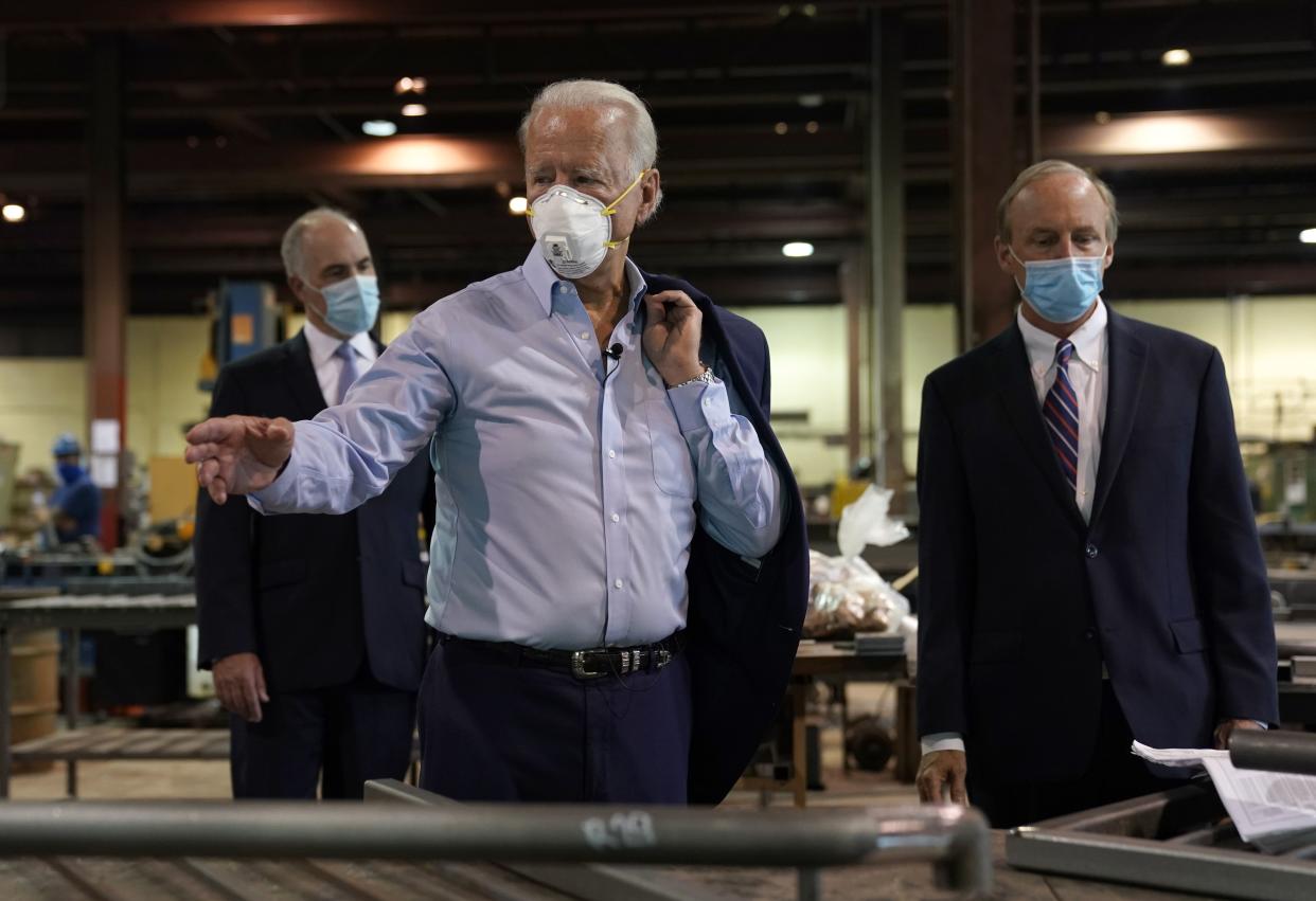 Democratic presidential candidate Joe Biden, with CEO and President, Bob McGregor (R), takes a tour at McGregor Industries in Dunmore, Pennsylvania, July 9, 2020. - Biden has unveiled a sweeping $700 billion plan Thursday to help the battered US economy recover from the coronavirus crisis, a direct challenge to Donald Trump's "America First" agenda as they square off in the presidential race. (Photo by TIMOTHY A. CLARY / AFP) (Photo by TIMOTHY A. CLARY/AFP via Getty Images)