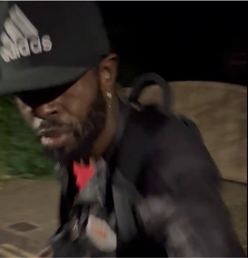 The force has released two pictures of him, showing a black man with a beard, wearing a black Adidas baseball cap, black jeans, a black jacket and black trainers with thick white soles and carrying a black backpack. (Met Police)