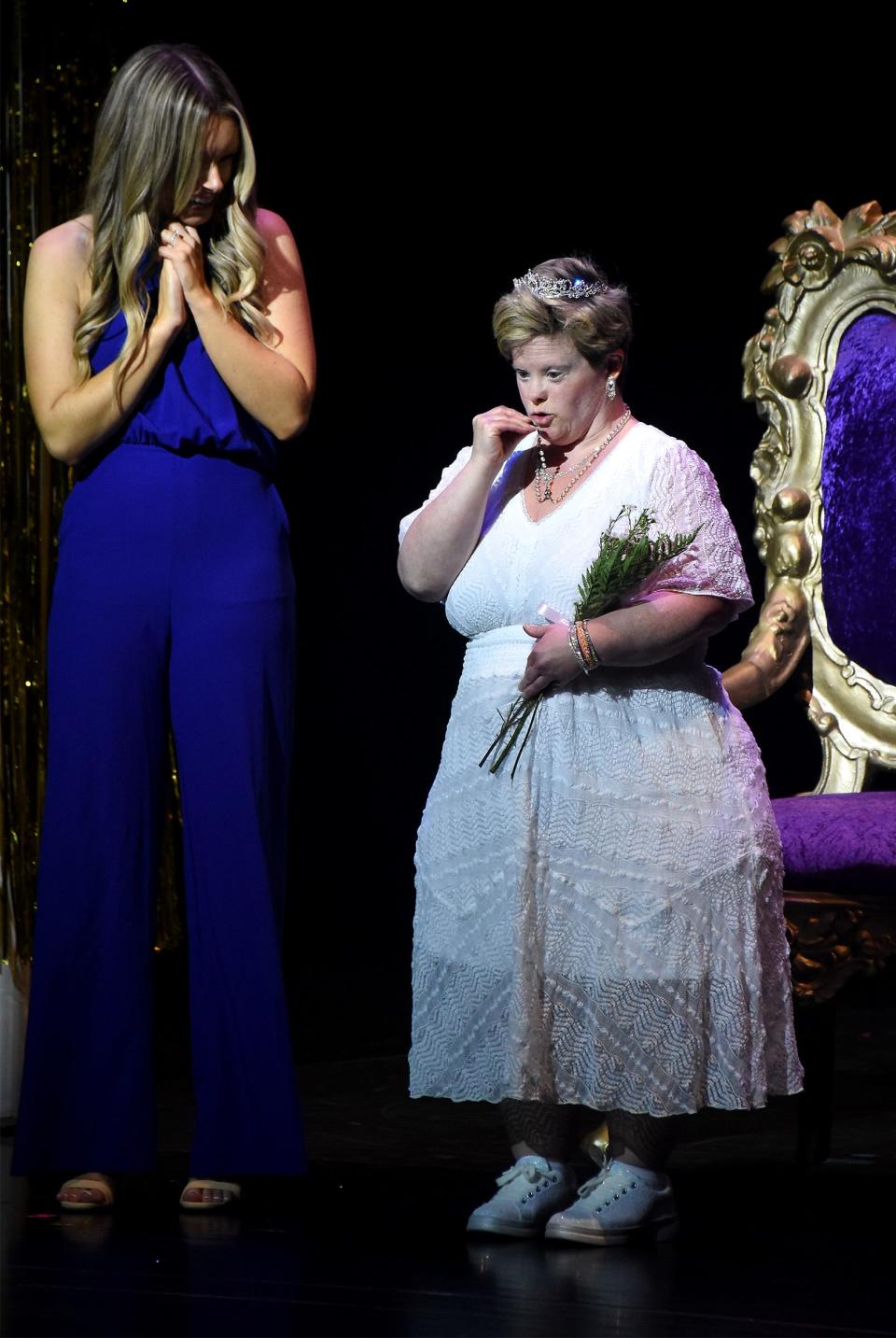 Honorary Junior Miss Monroe County Princess Leslie Larkins kisses her rosary after she was crowned at the Junior Miss County Princess program last August with her cousin Miss Monroe County Forever 2016 Alexis Newcomer held at the Meyer Theater La-Z-Boy Center at MCCC.