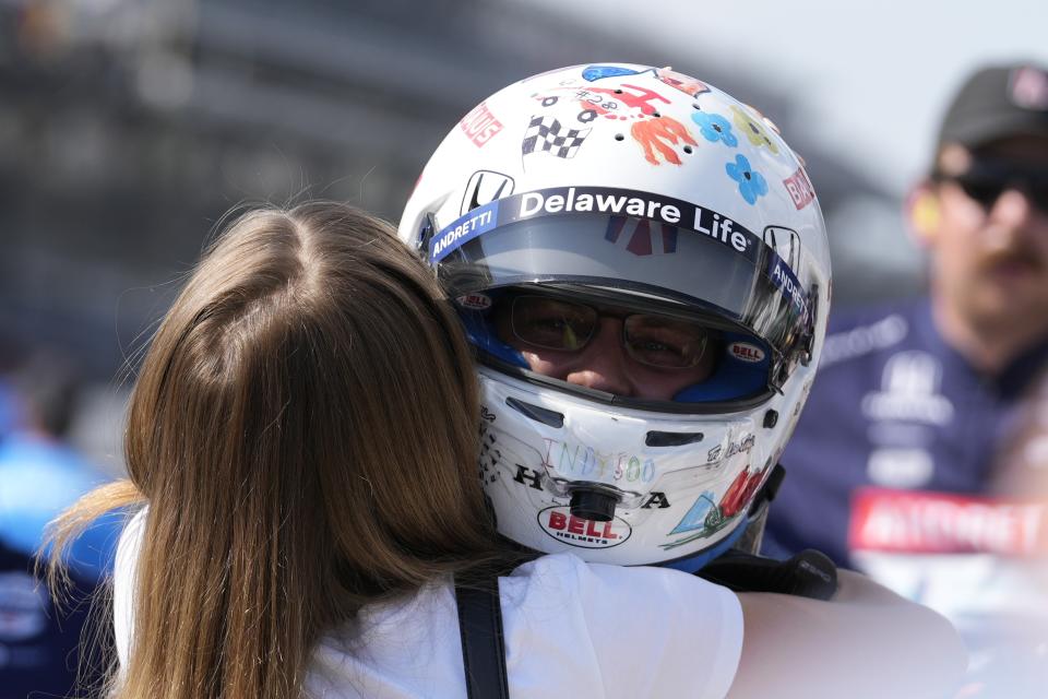 Marcus Ericsson, of Sweden, is hugged bit his wife, Iris Jondahl, after qualifying for the Indianapolis 500 auto race at Indianapolis Motor Speedway, Sunday, May 19, 2024, in Indianapolis. (AP Photo/Darron Cummings)