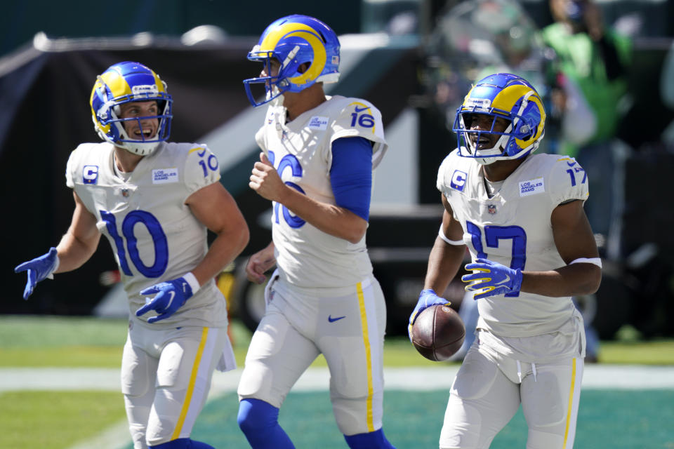 Los Angeles Rams' Robert Woods (17), Jared Goff (16) and Cooper Kupp (10) celebrates after a touchdown by Woods during the first half of an NFL football game against the Philadelphia Eagles, Sunday, Sept. 20, 2020, in Philadelphia. (AP Photo/Chris Szagola)