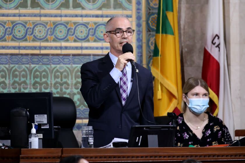 LOS ANGELES, CA - OCTOBER 11: Councilmember Mitch O'Farrell, current acting president, attempts to get the Los Angeles City Council meeting started at Los Angeles City Hall on Tuesday, Oct. 11, 2022 in Los Angeles, CA. Protestors want the resignation of Los Angeles Councilmembers Nury Martinez, Kevin de Leon and Gil Cedillo. Martinez made racist remarks about Councilmember Mike Bonin son in the recording as her colleagues, Councilmembers Kevin de Leon and Gill Cedillo, laughed and made wisecracks. (Gary Coronado / Los Angeles Times)