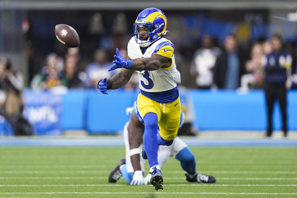 Los Angeles Rams running back Cam Akers (3) reaches for the ball during the first half of an NFL football game against the Los Angeles Chargers Sunday, Jan. 1, 2023, in Inglewood, Calif. (AP Photo/Mark J. Terrill)