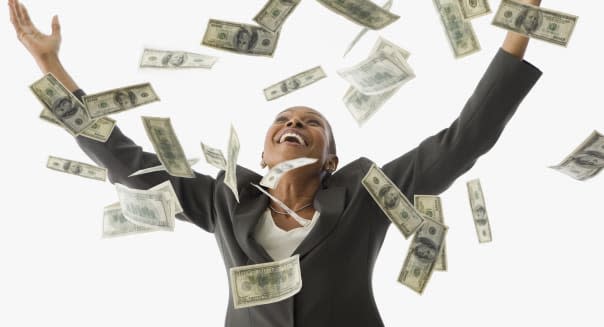 African American businesswoman throwing money in the air