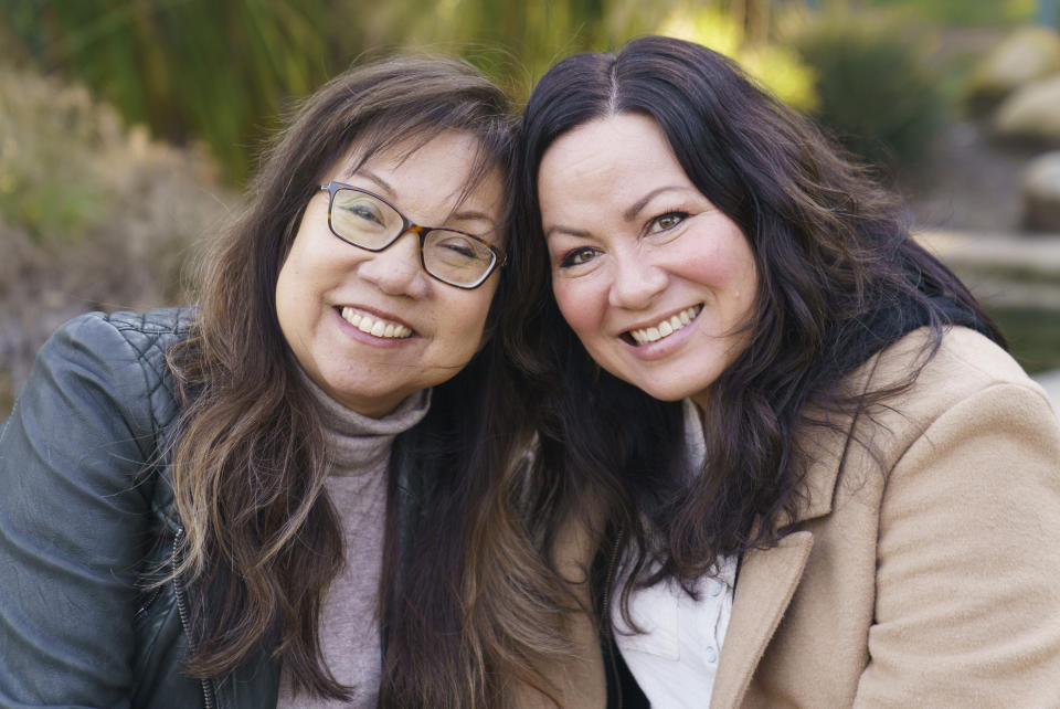 Anna Wong, niece of the late actress Anna May Wong, left, poses with Shannon Lee, daughter of the late martial arts actor Bruce Lee, at Douglas Park in Santa Monica, Calif., on Tuesday, March 7, 2023. They both discovered parallel experiences protecting the legacy of a family member who happens to be a Hollywood and Asian American icon. (AP Photo/Damian Dovarganes)