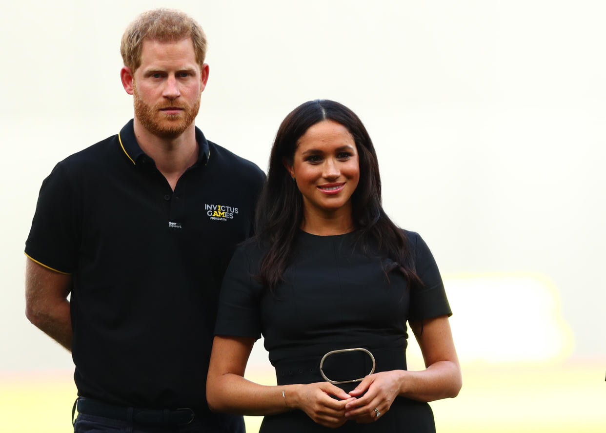 LONDON, ENGLAND - JUNE 29:  Prince Harry, Duke of Sussex and Meghan, Duchess of Sussex look on during the pre-game ceremonies before the MLB London Series game between Boston Red Sox and New York Yankees at London Stadium on June 29, 2019 in London, England. (Photo by Dan Istitene - Pool/Getty Images)
