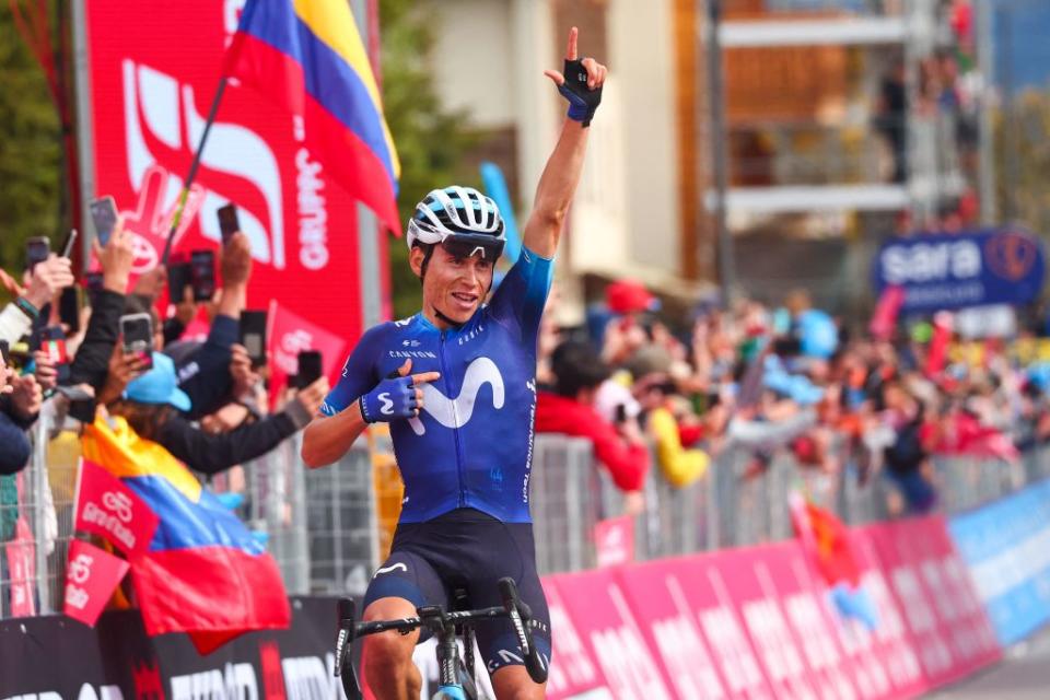 Movistar Teams Colombian rider Einer Rubio celebrates as he crosses the finish line to win the thirteenth stage of the Giro dItalia 2023 cycling race which start was transfered from Borgofranco dIvrea to Le Chable in Switzerland due to bad weather conditions and CransMontana on May 19 2023 Photo by Luca Bettini  AFP Photo by LUCA BETTINIAFP via Getty Images