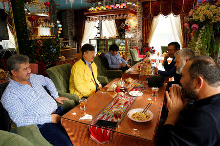 Chef Mohammed Siddiq chats with guests at his traditional Uighur restaurant in the Zeytinburnu district, which hosts most of the Uighur exiles, Istanbul, Turkey, December 3, 2018. REUTERS/Murad Sezer