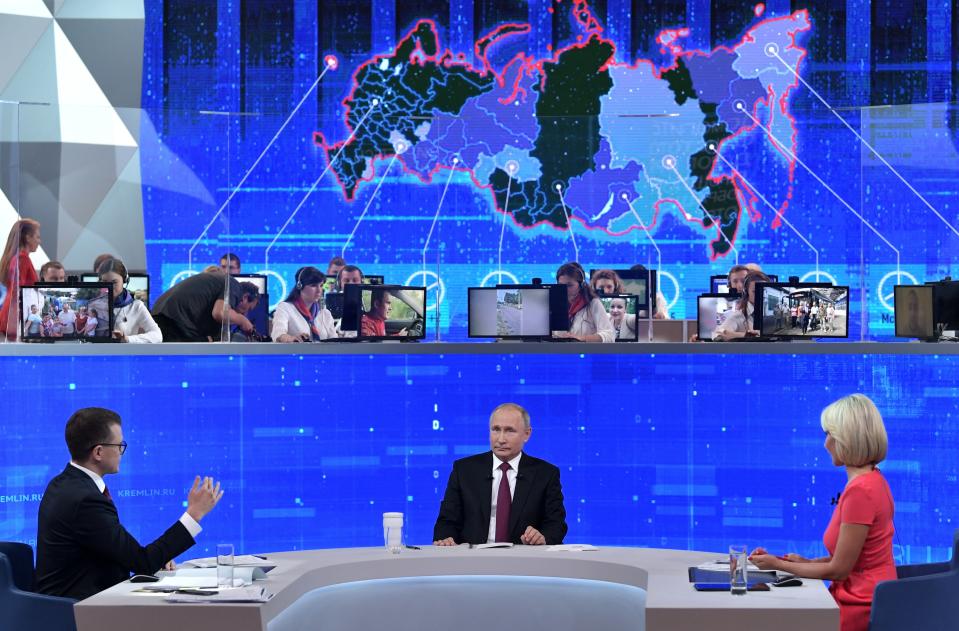 Russian President Vladimir Putin, center, attends an annual call-in show in Moscow, Russia, Thursday, June 20, 2019. Putin hosts call-in shows every year, which typically provide a platform for ordinary Russians to appeal to the president on issues ranging from foreign policy to housing and utilities. (Alexei Nikolsky, Sputnik, Kremlin Pool Photo via AP)