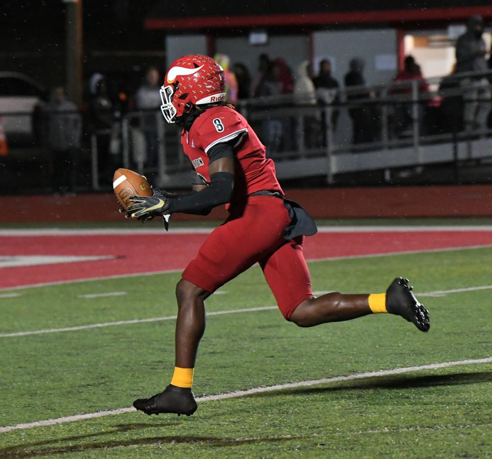 P.J. Nelson sprints to the endzone for a Princeton touchdown as part of a strip-sack, scoop and score against Sycamore, Oct. 20, 2023.