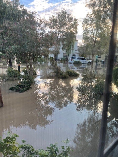 A view from Lydia Duran's window during the immediate aftermath of Tropical Storm Hilary shows flooding in the Spanish Walk neighborhood of Palm Desert.