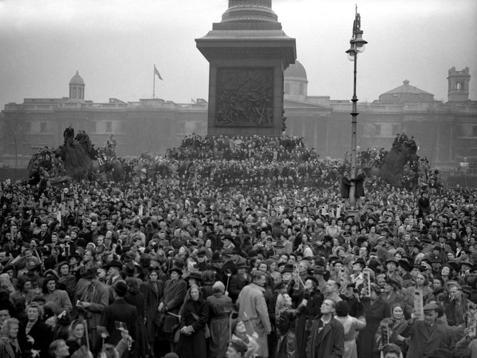 Nelson's Column with it's surrounding Lions made useful advantage points for some of the thousands who were already jamming Trafalgar square (PA )